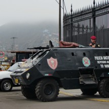 Military in Lima's center on the shore of Rio Rimac